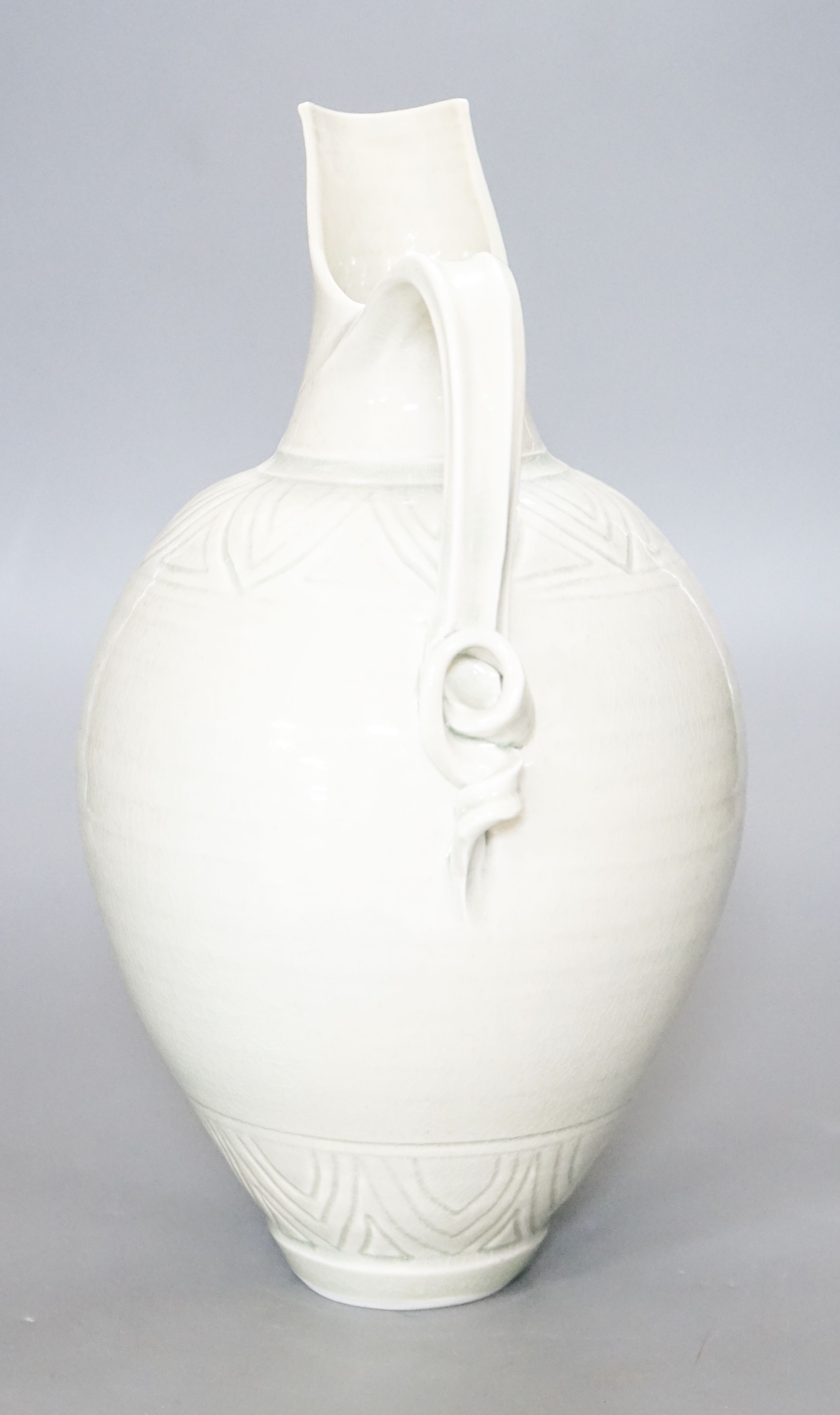 Bridget Drakeford (b.1946), a celadon glazed porcelain jug 30cm